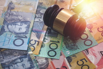 Judge's gavel on australian dollars, justice concept