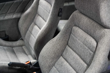Classic renovated sport car seats in grey colour and natural premium wool material