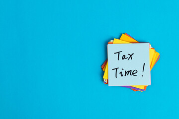 Tax time written on sticky note