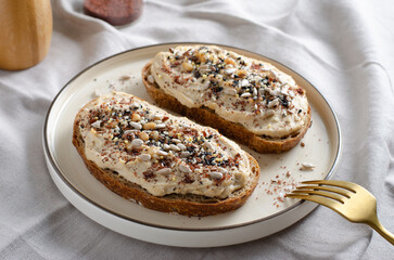 Hummus Toast with Rustic Bread, Vegetarian Snack or Breakfast on Bright Background