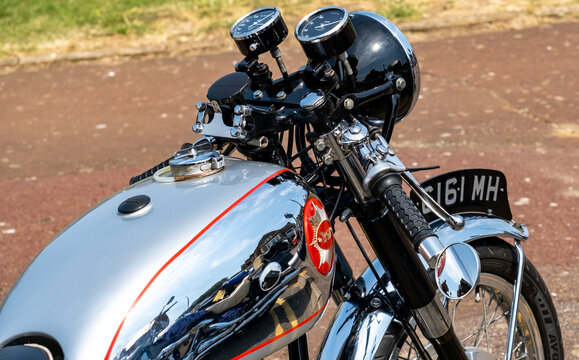Close up of a classic and vintage BSA cafe racer motorcycle parked up on the promenade in the seaside town of Hunstanton on the North Norfolk coast