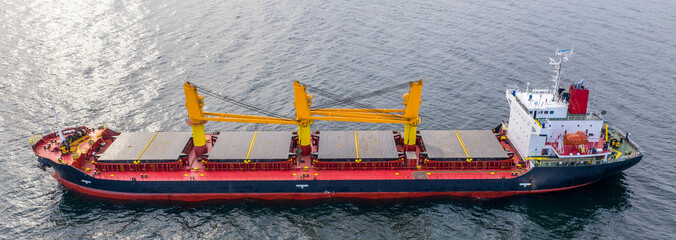 Panoramic view of cargo ship vessel import-export sailing. Transportation concept.