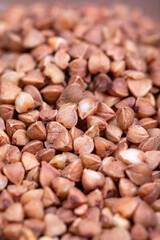 Pile of buckwheat grains as background, spice or seasoning as background. close-up buckwheat