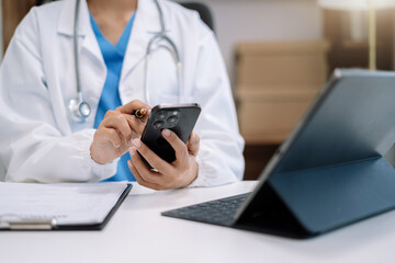 Doctor work on digital smartphonr and tablet healthcare doctor technology tablet using computer in...