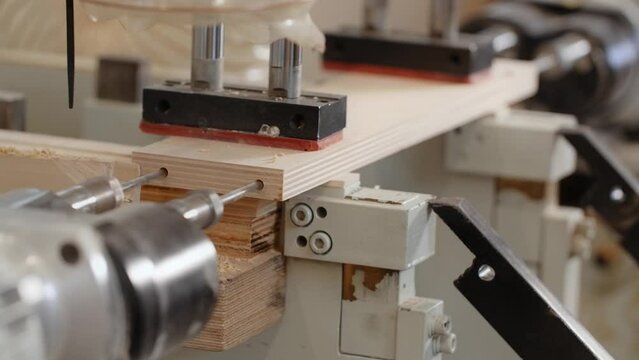 Working process of the CNC drilling machine in a furniture factory