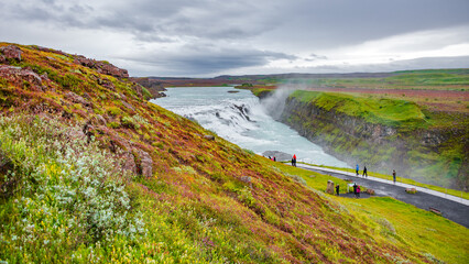 Wonderful waterfall Gullfoss, Golden waterfall in South West Iceland, with many tourists