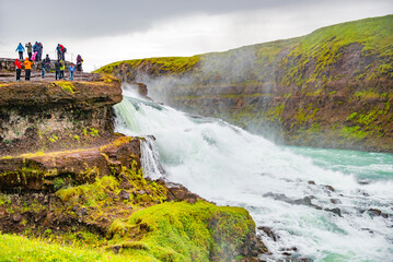 Wonderful waterfall Gullfoss, Golden waterfall in South West Iceland, with many tourists