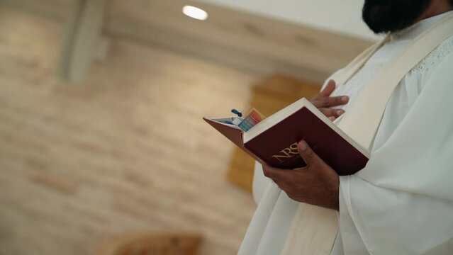 the pastor waves his hand and reads the psalter