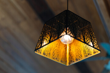 The golden light pendant ceiling lamp has a square iron frame in a modern shape. Home decoration...