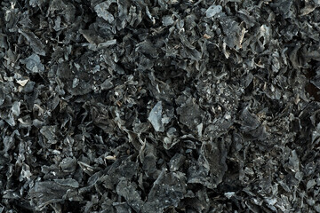 The ashes of burnt paper as background, top view. Texture of cinder.