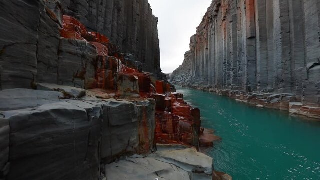 Majestic summer view of Studlagil Canyon. Unbelievable morning landscape of Jokulsa A Bru river. Fantastic outdoor scene of Iceland, Europe. Full HD video (High Definition)..