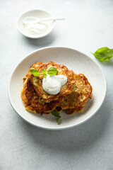 Traditional homemade latkes with sour cream
