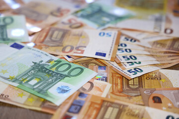 Euro banknotes on the table. Close up of euro cash money background, concept of finance and good earnings