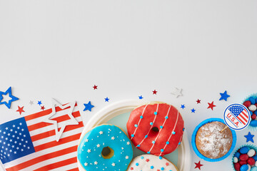 Dessert-centered festivity on July 4th idea. Top view flat lay of donuts on the plate, cupcake,...