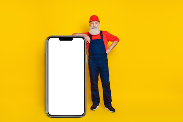 Full length photo of retired artisan advertise reconstruction web service on smart phone isolated bright color background