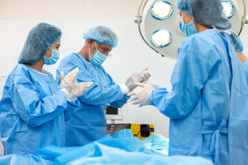 Professional anesthesiologist doctor medical team preparing patient to gynecological surgery operating with surgery equipment, save life, pain, surgical, hurt in hospital operation emergency room