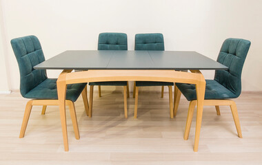 Wooden table and four chairs, office interior