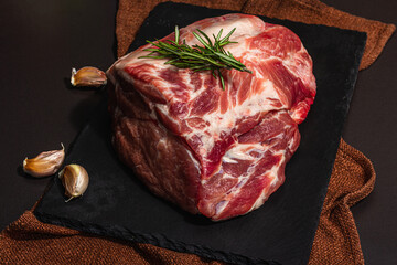 Raw pork loin with spices and herbs. Fresh meat cut, ingredient for cooking protein food