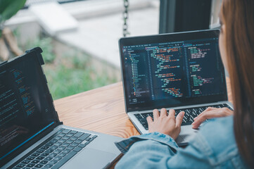 Female programmer working on coding, software development and web design.Concept technology development.
