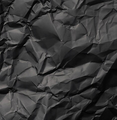 Black creased crumpled paper background grunge texture background