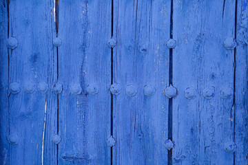 Detail of an old blue wooden door