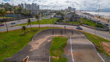 Fototapeta premium Drone view of curve with competitors in bmx race