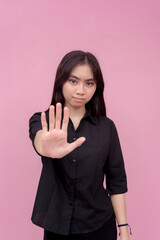 A young lady with strong values commands someone to stop. Telling someone to stop with vices....