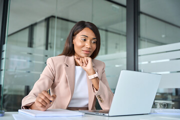 Busy professional young African American business woman company manager executive wearing suit...