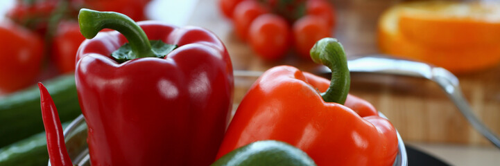 Fresh juicy vegetables and fruits in kitchen on table. Organic healthy wholesome vegetable food concept