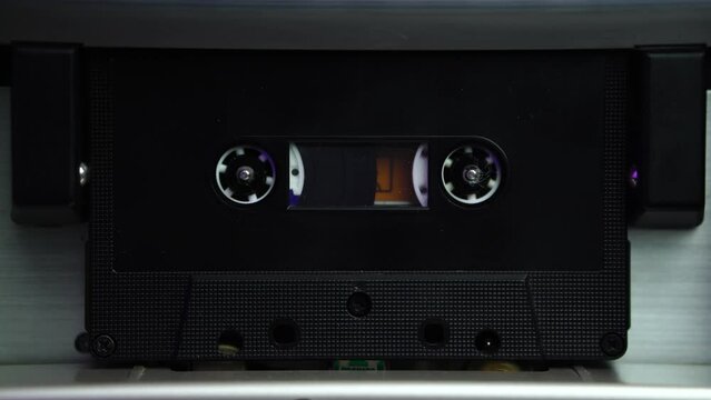 Inserting and Playing Black Audio Cassette Tape in Vintage Deck Player, Close Up