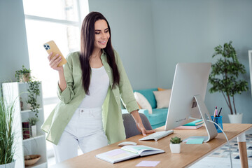 Photo of successful banker chief ceo stand table use gadgets reading cv resume candidates inside...