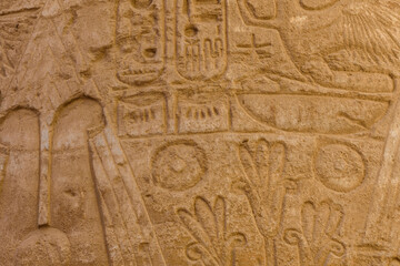 Egyptian ancient hieroglyphs on the stone wall