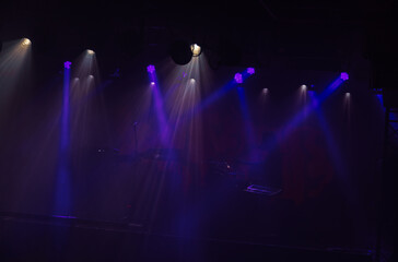 spotlights on stage before a concert 