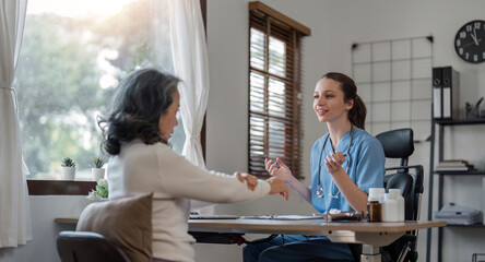 Senior care, healthcare insurance and caregiver woman sitting with elderly woman patient laughing and talking while enjoying retirement home. Old lady and female nurse hospice with health check form