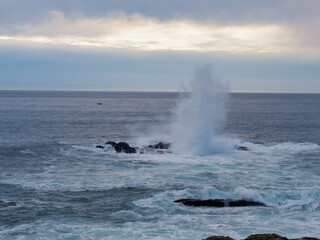 waves crashing on rocks