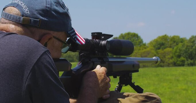 Old Man Takes Aim With His Rifle At The Precision Rifle Series Match In Leach, Oklahoma. closeup