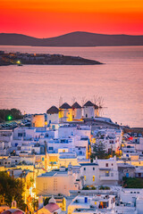 Mykonos, Greece. Sunset over Aegean Sea and the famous windmill from above, Cyclades. - obrazy, fototapety, plakaty