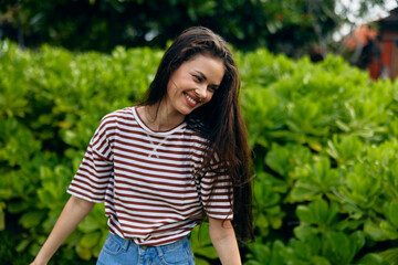Fototapeta premium woman lifestyle beautiful summer t-shirt sun park walk smiling nature freedom