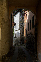 Narrow street in typical alpine village, Valle Maggia, Ticino, Switzerland.