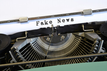 words 'Fake News' typed on vintage typewriter. Concept for spreading fake news