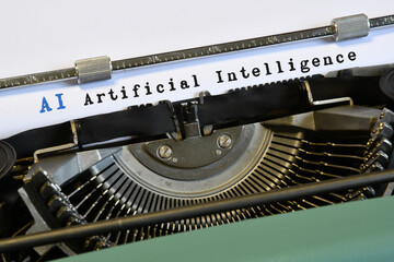 words 'AI Artificial Intelligence' typed on vintage typewriter. Artificial intelligence is a discipline that studies intelligent computer systems capable of simulating human capabilities.