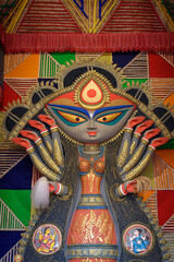 Idol of Goddess Devi Durga at a decorated puja pandal in Kolkata, West Bengal, India. Durga Puja is a famous and major religious festival of Hinduism that is celebrated throughout the world.