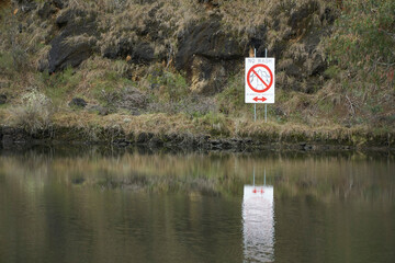 A sign on Talbingo Dam, warning that this area is a no-wash zone for boat traffic