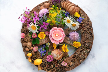 Altar for Summer solstice, Litha wiccan holiday. wheel of the year with colorful flowers and candle...