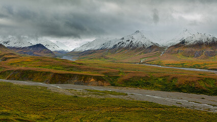 Landscape with snow covered mountains and tundra in autumn colors, Denali National Park Alaska
