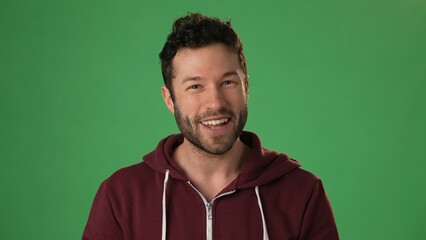 Smiling confident young teacher man professional looking at camera on green screen chroma key. Happy smiling millennial businessman, student, worker, close up face portrait. Concept remote learning.