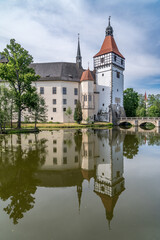 Fototapeta na wymiar Mirror reflection of Blatna water castle in Bohemia