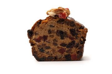 A cake with dried fruits, raisins almonds, dried strawberry.