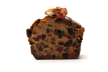 A cake with dried fruits, raisins almonds, dried strawberry.
