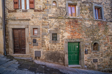Fototapeta na wymiar Door in the Etruscan city of Cortona, Tuscany Italy